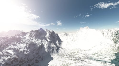 Mountains in Snow and Clouds at Blue Sky
