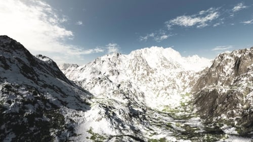 Mountains in Snow and Clouds at Blue Sky
