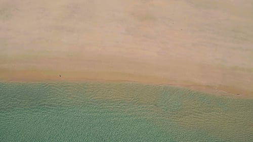Aerial View Small Waves on Sandy Beach