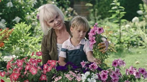 Grandmother and Granddaughter in Garden