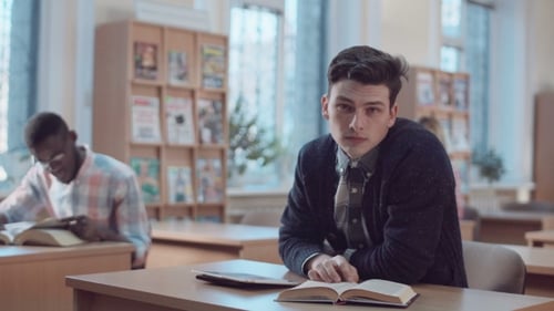 Students Reading Books in a Classroom