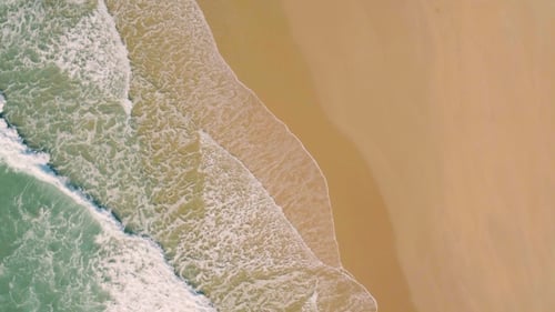 Aerial View Small Waves on Sandy Beach