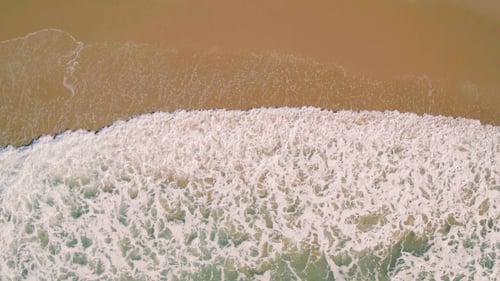 Aerial View Small Waves on Sandy Beach