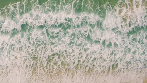 Aerial View Small Waves on Sandy Beach