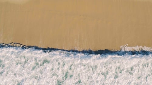 Aerial View Small Waves on Sandy Beach