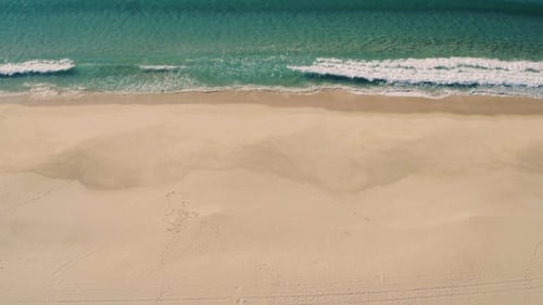 Aerial View Small Waves on Sandy Beach