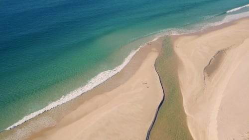Aerial View Above Ocean Beach with Channel