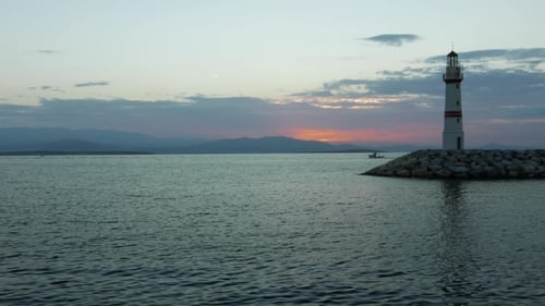 Lighthouse and Breakwater with Fishing Boat