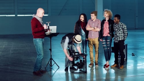 Camera Team Discusses Video Equipment on Set