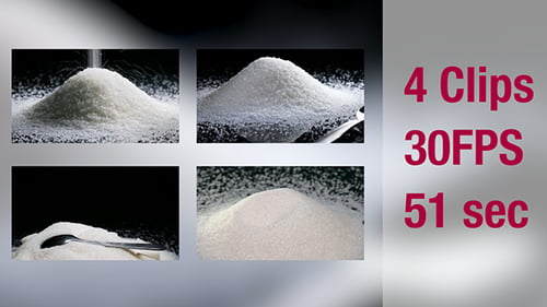 Heap of White Granulated Sugar and Spoon
