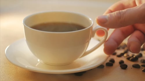Coffee Cup with Coffee Beans, Close Up