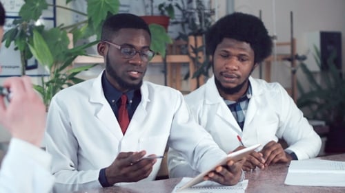 Medical Students Consult with Tablet and Stethoscope