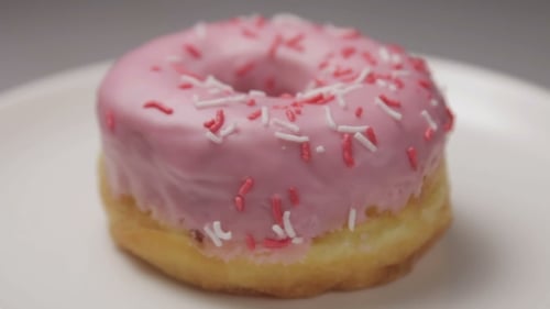 Delicious Doughnut with Pink Glaze and Sprinkles