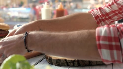 Hands Making a Burger