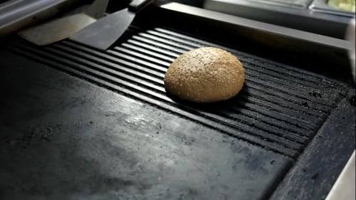 Burger Buns Placed on Commercial Grill