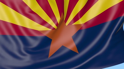 Waving Flag of Arizona State Against Blue Sky