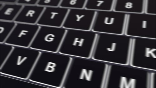 Teclado de computadora negro y tecla de reproducción brillante