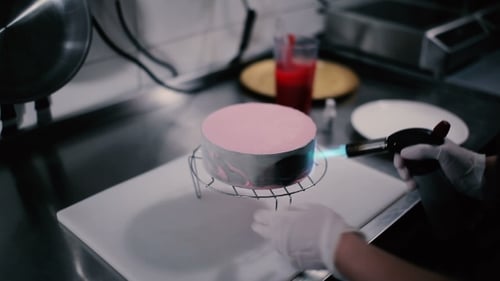 Cook Burner Heats the Iron Mold with Cake.