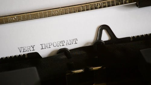 Typing Very Important Message on Vintage Typewriter