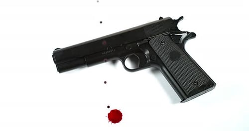 Pistol and Blood against Black background, Slow Motion 4K