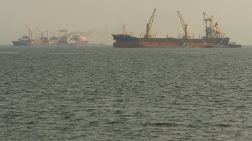 Cargo Ships Float in the Sea
