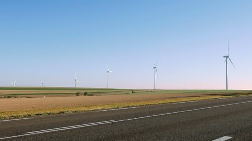 Wind Turbines in Rural Landscape on Sunny Day