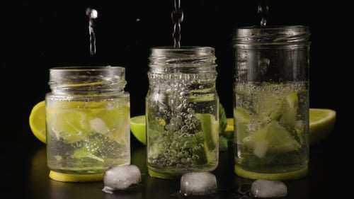 Lemon Lime and Mint Water Being Poured