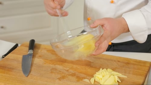 Chef Preparing Food in Bright Kitchen