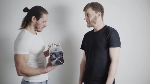 Men Consider Asic for Mining Discuss Bitcoin