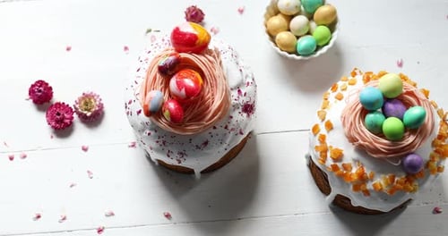 Easter cake with chocolate eggs decoration, on white wooden table