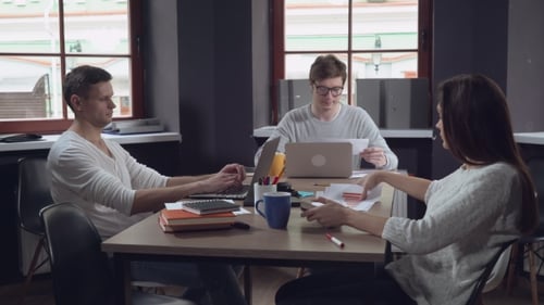 Business Team Sitting at the Working Place.