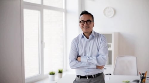 Happy Asian Businessman Waving Hand at Office 48