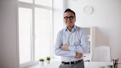 Happy Asian Businessman Waving Hand at Office 49