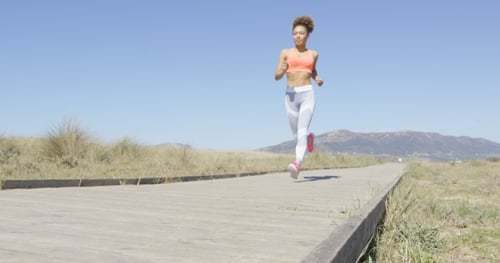 Woman Running on a Pavement