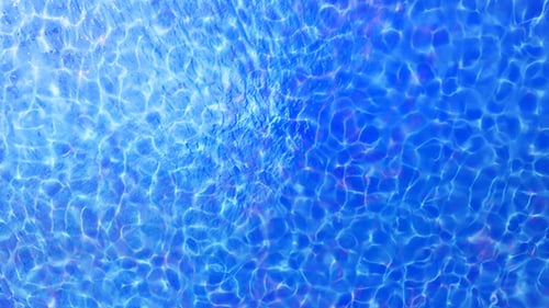 Shimmering Blue Water Surface Ripples Loop Background