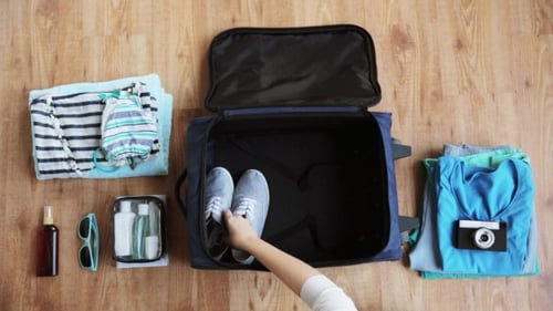 Hands Packing Travel Bag with Personal Stuff 22