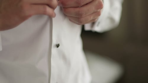 Groom Buttons Shirt Getting Ready for Wedding Day