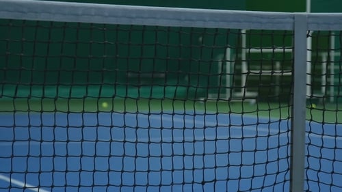 A Tennis Ball Hits the Net
