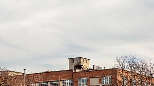 Moving Clouds Over Old Bricks Building