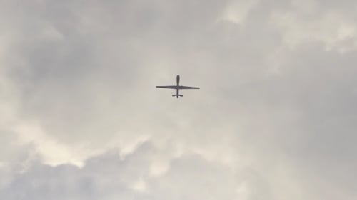 Unmanned Aerial Vehicle Flying in Cloudy Sky