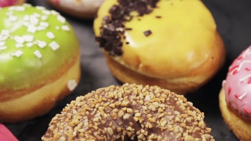 Delicious Donuts with Colorful Glaze and Toppings