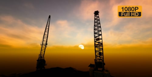 Construcción de edificios grúa y puesta de sol
