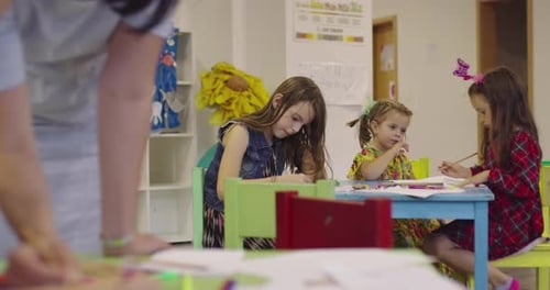 Creative Kids During an Art Class in a Daycare Center or Elementary School Classroom Drawing with