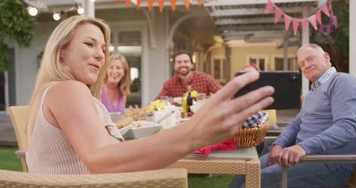 Woman Takes Selfie With Family at Birthday Party