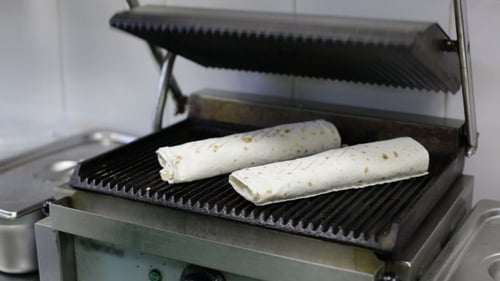 Cooking Wraps in a Restaurant Sandwich Press
