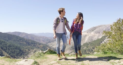 Sweet Couple on Summit of Mountain