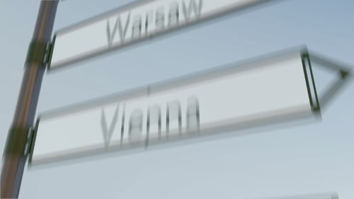 Amsterdam Direction Sign on Road Signpost with European Cities Captions