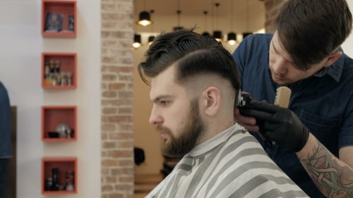 Man Getting Haircut at Barbershop