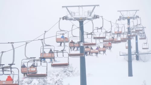 Lift at Ski Resort Transports Skiers