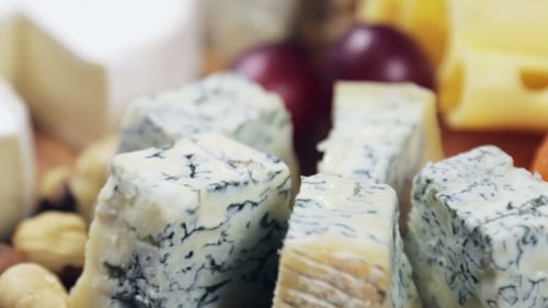 Delicious Cheese Board with Grapes and Dried Apricots